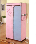 Heavy Duty Foldable Closet Wardrobe Featuring Sturdy Steel Pipe Frame And Portable Clothes Organizer With Long Hanging Rod and colorful design in room.