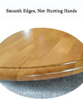 Close-up of smooth edges on a huge 30 inch solid wood lazy Susan turntable for dining tables with eco-friendly teak finish.