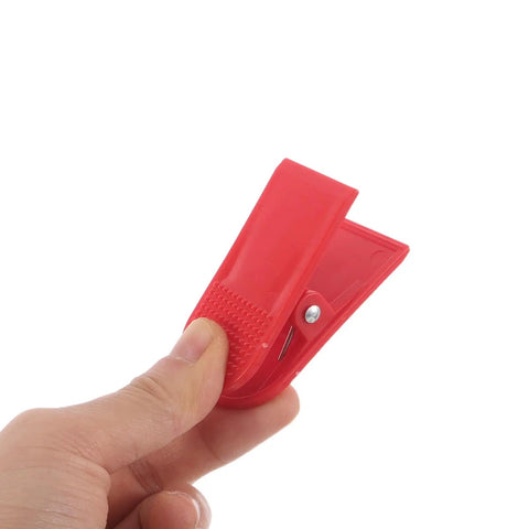 Hand holding red 12 Pack Universal Treadmill Safety Switch Clips Spring Loaded Emergency Stop Accessories For Home Gym Running Machines Replacement Must Have Parts Built For Quick Easy Fit On Most Models
