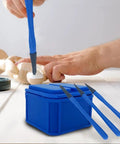 Top Shelf Silicone Glue Brush Kit Four Piece Woodworking Applicator Set With Airtight Jar, blue brush applying glue on wood.