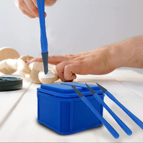 Top Shelf Silicone Glue Brush Kit Four Piece Woodworking Applicator Set With Airtight Jar, blue brush applying glue on wood.