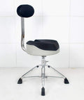 Heavy Duty Foldable Drum Stool With Padded Backrest And Height Adjustable Seat, Rock Solid Steel Frame, Anti Slip Rubber Feet, Tight Control For Piano Guitar Or Live Sessions, Black viewed from the side.