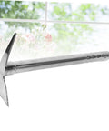 Stainless Steel Garden Pickaxe Hoe Grab-And-Go Double-Use Tool For Planting And Weeding against a garden window backdrop