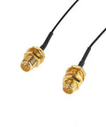 Close-up of RP-SMA Female connectors with cables in the Dual Band 8dBi WiFi Antenna Kit With RP-SMA Male Connectors And 2 x 35cm UFL IPEX To RP-SMA Female Pigtail Cables For Mini PCIe Cards Routers Repeater Desktop FPV UAV Drones And PS4 Builds