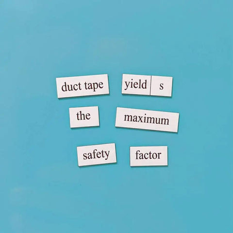 Nerdy Engineer Word Magnet Kit For College To PhD And Pro Engineers With Hilarious Poems Prose And Jokes For Your Office Fridge Or Whiteboard displayed on a blue surface with magnets forming a phrase.