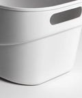 Top Shelf White Plastic Storage Basket With Lidless Opening For Zero Fuss Organization And Straight Up Space Saving Efficiency Ideal For Cozy Living Room Or Bedroom Vibes, close-up view of smooth white plastic.