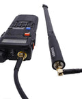 23.6 Inch Coaxial Antenna Extension Cable With SMA Female To SMA Male Connectors For Baofeng UV 5R Series Two Way Radios Enhance Range And Clarity For Clearer Transmissions In Any Situation, showing connector detail attached to radio.