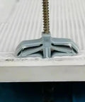 Butterfly Shaped Wall Anchors Set For Drywall And Wood Self Drilling Plugs With Internal Threads Nylon And ABS Construction Anti Rotational Design Easy Install 400 Piece Assortment For DIY Shelving And Storage close-up of anchor in drywall