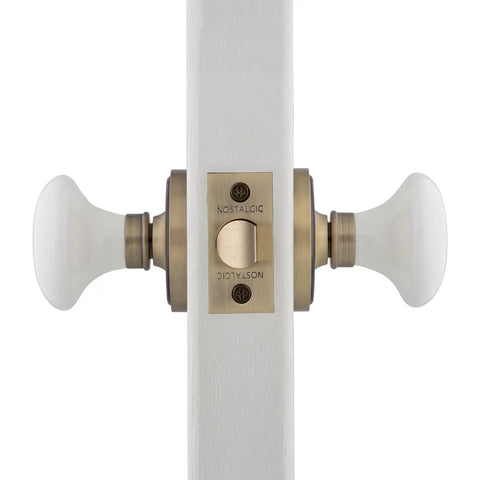 Classic Rosette White Porcelain Round Door Knob That Brings Old School Charm To Your Doors, Durable Porcelain Build, Timeless Vintage Vibe, And Ready In Multiple Finishes For Interior Entry Or Closet Doors