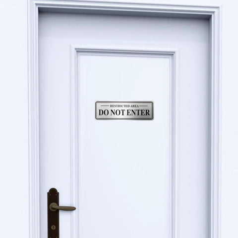 Heavy Duty Stainless Steel Do Not Enter Sign For Restricted Areas With Solid Peel And Stick Backing on a white door.