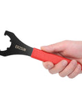Premium High Carbon Steel Clamping Nut Wrench For ER32 Collet Chuck Spanner with red ergonomic handle being held.