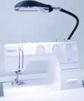 Ultra Bright Dope Performance Sewing Lamp With 50 LED Lights And A 30 Inch Flexible Gooseneck attached to a sewing machine.