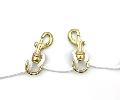 Heavy Duty Brass Flagpole Snap Clips Two Piece Set With Swivel Eyelet And Secure Halyard Rope Attachment For Outdoor American Flags close-up of brass clips on white rope.