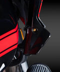 Fresh Gold Titanium Handlebar Clamp Bolts And Brake Clutch Perch Screws viewed on a Harley motorcycle with red accents.