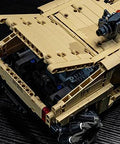 Close-up of technic RC Hummer kit showcasing open trunk detail and Mecanum wheels on a dark surface.