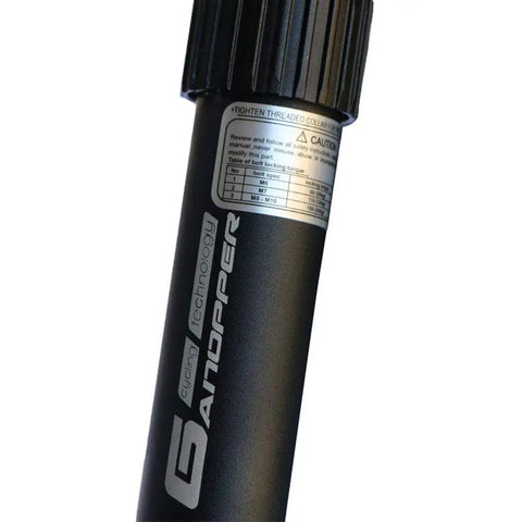Close-up of 25.4mm Seatpost Suspension With Spring For Fixie BMX And Road Bikes with label and tightening instructions