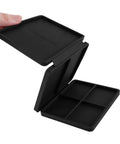 Hand holding a black Portable Tri Fold Silicone Tool Tray With Magnetic Sheets Included Heat Resistant And Flame Retardant Durable Silicone