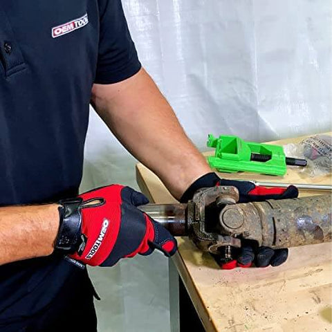 Person using a Beefy Heavy Duty U Joint Puller For Intermediate Trucks Buses And Farm Equipment Universal U Joint Removal Tool