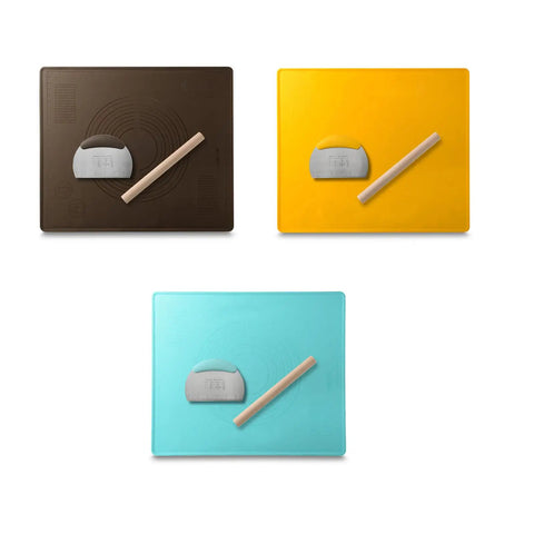 Three silicone baking mats in brown, yellow, and blue with rolling pins and dough scrapers.