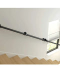 Straight Up Rock Solid Black Iron Railing For Indoor And Outdoor Use Adjustable Height Safety Guardrail With Rustproof Finish For Decks Patios And Staircase Installation along a staircase.