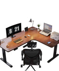 Rock Solid Electric Height Adjustable L Shaped Standing Desk for Home Office Corner Workspace with dual monitors and chair.