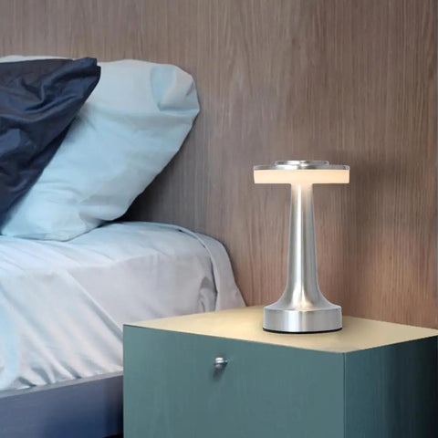 Cordless Metal Desk Lamp with Touch Sensor on bedside table, sleek silver LED, 3 color temperature modes, night light for nursery.