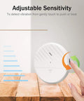 Ultra Slim Wireless Glass Break Alarm Sensor 125dB showing adjustable sensitivity with hand gesture illustration and wooden surface