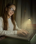 Clip-On Reading Light for Books in Bed, Car and Travel, 3000K Warm LED, illuminating a girl's study area, portable lamp