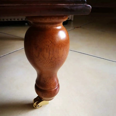 Solid Brass Swivel Castor Wheels With Smooth Rubber Glides For Heavy Furniture Vintage Antique Dining Chair Casters on wooden leg.
