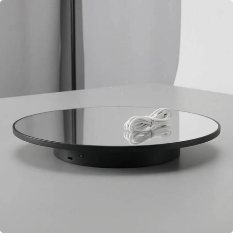 Stupendous Electric Rotating Display Stand With 360 Degree Turntable Rotation For Professional Jewelry Photography And Small Item Filming Featuring A Rock Stable Round Base To Crank Up Your Product Shots, with a mirrored surface and power cord.