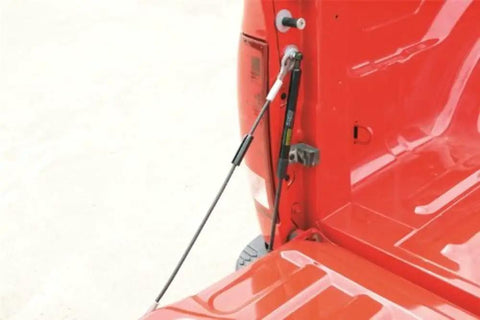 Close-up of Tailgate Assist Kit installed on Ram 1500 2002 to 2008 and Ram 2500 3500 2003 to 2009, showcasing easy bolt-on install feature.