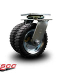 Heavy Duty Six Inch Pneumatic Caster Wheels With Ball Bearing Swivel And Welded Steel Top Plate Mount close up view on a garage floor