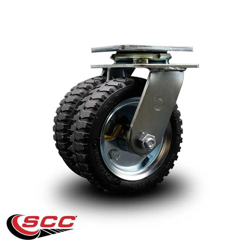 Heavy Duty Six Inch Pneumatic Caster Wheels With Ball Bearing Swivel And Welded Steel Top Plate Mount close up view on a garage floor