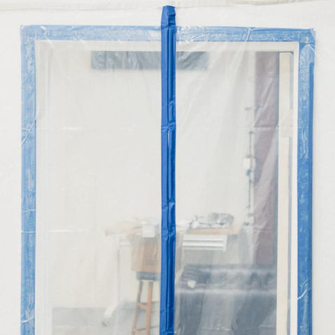 Front view of E-Z UP magnetic dust containment door kit: clear plastic door with blue magnetic strip.