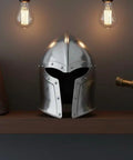 Medieval Barbuta Helmet With Liner for Larp, Cosplay, Halloween and Theatrical Props displayed on a shelf with books and telescope.