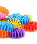 Close-up of colorful plastic gears from Interlocking Gears Kit For Kids With Tote Bag Hands On Fun 100 Colorful Pieces For Sensory Play
