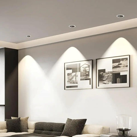 LED Recessed COB Spotlight illuminating artwork on wall above a couch in a modern living room.