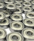 Close-up of multiple Miniature Deep Groove Ball Bearing 629ZZ 9x26x8mm Shielded Pieces in steel, ideal for RC and small machinery.