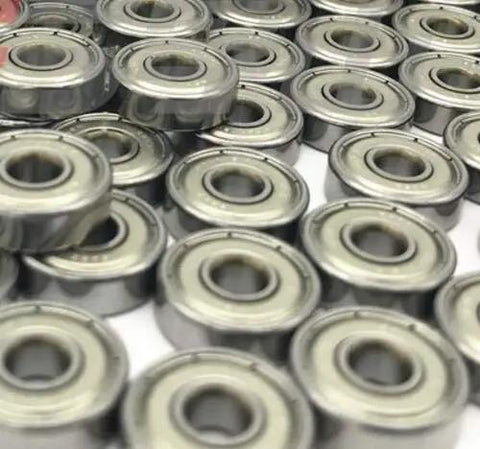 Close-up of multiple Miniature Deep Groove Ball Bearing 629ZZ 9x26x8mm Shielded Pieces in steel, ideal for RC and small machinery.