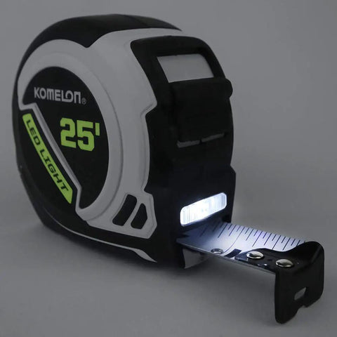 Rechargeable LED Light Tape Measure 25ft 1 Inch Tape With Slimline Case Nylon Coated Blade glowing in dark environment