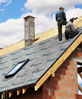 Workers installing Heavy Hitter Synthetic Roof Underlayment Backed By A Lifetime Warranty For Tough Roof Replacement Jobs on a roof.