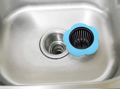 Go-To Kitchen Sink Strainer 4 Pack Silicone Drain Filters With Wide Rim 4.5 Inch Diameter in blue, shown on a stainless steel sink.