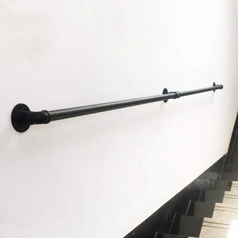 Heavy Duty Rustic Industrial Pipe Railing And Beefy Wrought Iron Handrail For Porches Decks Stairs Delivering Rock Solid Support mounted along a wall