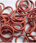 Pro Grade Heavy Duty Silicone O Ring Seal 7.28 Inch Outer Diameter 7.0 Inch Inner Diameter 0.14 Inch Cross Section VMQ Red Gasket For Engines Faucets Flanges Valves Pipes And Compressors, shown in a pile of multiple red rings on a surface.