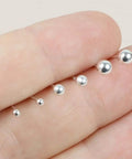 Hypoallergenic Sterling Silver Round Ball Stud Earrings Set For Women And Men With Butterfly Backs Three Pairs In 2mm 3mm And 4mm Sizes Lightweight Minimalist Everyday Jewelry, shown in hand