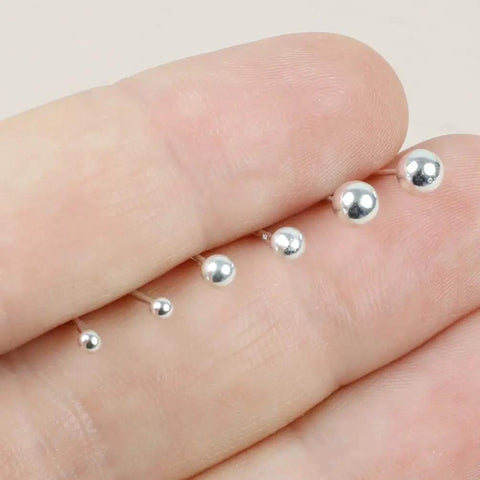 Hypoallergenic Sterling Silver Round Ball Stud Earrings Set For Women And Men With Butterfly Backs Three Pairs In 2mm 3mm And 4mm Sizes Lightweight Minimalist Everyday Jewelry, shown in hand