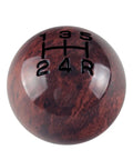 Aluminum and wooden weighted shift knob for manual transmissions with black engraved inlay, two and one eighth inch diameter.