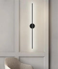 DFEDHF Minimalist Black Linear Wall Sconce - Slim LED Stick Light Fixture for Indoor Use, mounted on a wall beside a modern chair.