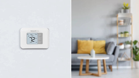 Non Programmable Thermostat With Backlit Display And No Fuss Simple Manual Controls, wall-mounted in living room view