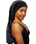 Woman wearing Extra Large Satin Sleep Cap For Long Hair And Braids Silk Bonnet For Overnight Protection No Slip Fit, Soft Black.